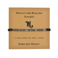 Detail view of Scorpio Morse code beaded bracelet on cardstock with zodiac chart - Scorpio