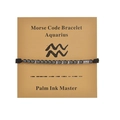 Detail of Aquarius Morse code bracelet with black cord and silver beads on display card - Aquarius