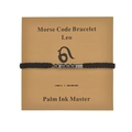 Detail of Leo Morse Code bracelet with black beads on a minimalist display card - Leo