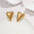 Textured hammered heart stud earrings in gold stainless steel on elegant stone background - Gold Heart Hammered (Heart Studs)