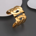 Detail of wide 18k gold plated stainless steel cuff bracelet with hollow texture design - Hollow Intertwined Geometric Style