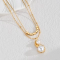 Collana a doppio strato in acciaio al titanio placcato oro 18K con ciondolo in perla naturale - Oro