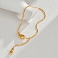 Detail of gold snake chain necklace featuring a curved liquid drop pendant and polished finish - Liquid Metal Water Drop Style (Style 3)