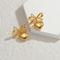 French bow heart earrings in gold-plated stainless steel on a white stone base - Gold Bow Gold Heart Stud Earrings