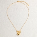 Chic gold bow and heart pendant necklace with satellite chain on a textured surface - Bowknot Heart Necklace