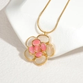 Elegant gold camellia flower pendant necklace with pink and cream oval gemstone petals - Pink and Cream Camellia Necklace