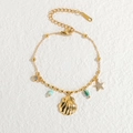 Ocean themed 18k gold plated titanium steel bracelet with shell and starfish charms - Bracelet