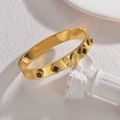 18K gold butterfly open bangle with black square stones and beaded edges on white decor - Black Zirconia