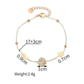 Golden stainless steel bracelet featuring seahorse, rhinestone shell and star charms - Shell Style (1130)