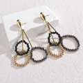 Chic gold teardrop earrings with beaded tassel rings on a minimalist white stone pedestal - Gold Teardrop Three-Layer Three-Color Beaded Style