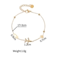 Gold-tone vacation bracelet with plane, coconut tree, and sandal charms with lobster clasp - Airplane Style (1136)