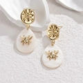 Retro golden spider drop earrings with white teardrop pendants and metallic finish - Gold Spider Teardrop Style