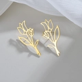 Elegant gold hollow tulip flower drop earrings on soft fabric background - Gold