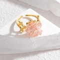 Adjustable gold plated stainless steel ring featuring a pink crystal flower charm - Pink