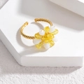 Fashionable floral crystal bead open ring in gold finish on geometric display stand - Yellow
