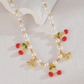Close-up of cherry pendant necklace with white beads and red enamel details - Cherry Style (N2214-yingtao)