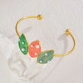 Close-up of golden enamel leaf bracelet with white pearls on a minimalist background - Three Leaves Style (B1174-yezi)
