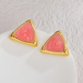 Macro shot of 18K gold-plated triangle earrings with pink marble inlay and ribbed edges - Coral Pink