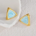 Detail of triangle stud earrings with gold frame and light blue marble inlay on white stone - Light Blue