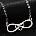 Macro shot of silver infinity necklace with double heart design and sparkling crystal - Silver Heart Style (N142-01)