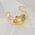 Golden ocean theme cuff bracelet with seashell star and pearls in a 45-degree side view - Shell & Starfish Style (B1194-B)