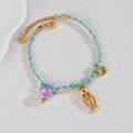 Dettaglio del bracciale oceanico in oro 18k con cordino intrecciato e ciondoli marini - Stile Polpo (B1213-zhangyu)