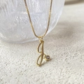 Detailed close-up of 14K gold plated J letter necklace with round cubic zirconia pendant - Gold (Letter J) (A1003-11A)