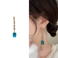 Boucles d'oreilles pendantes fleurs en zircon bleu avec accents dorés géométriques - Doré