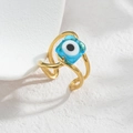Macro shot of French vintage gold-plated open ring with square blue glass Evil Eye charm - Blue Glass Bead Evil Eye Style (SFLR733-E-LAN)