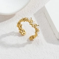 Close-up of golden star-shaped ring with small white pearls on a marble background - R689-zz