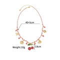 Détail du collier tressé coloré avec des breloques de fruits et fermoir en acier - Cordon Rose Blanc (OLBN2229-D)