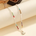 Bohemian beaded necklace with colorful spacers and a cute white crab charm pendant - Crab