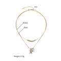 Double-layered 18k gold plated teardrop necklace with size markings on white background - Gold