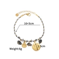 Vue détaillée du bracelet tressé avec breloques soleil, longueur 16+3cm, acier - Style Boussole et Palmier (OLBB1215-D)