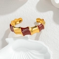 Minimalist wavy open gold-plated bangle with red enamel inlay on a shell tray - Red and Gold Bamboo Style / Gold