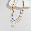 Dreilagige goldene Evil Eye Halskette mit Schlangenkette und blauen Perlenlagen - Goldene dreilagige Halskette