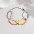 Three-tone stainless steel oval link bracelet with hammered texture and lobster clasp - Three Colors