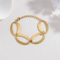 Golden oval link bracelet with hammered texture and adjustable chain for women - Gold