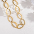 Chunky gold oval link chain necklace with hammered texture on white stone stand - Gold (SFLN2283-02)