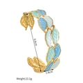 Vue détaillée du bracelet en titane doré avec feuilles d'émail colorées et dimensions - Bleu