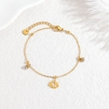 Elegante pulsera de loto en oro de 18 quilates con circonitas sobre fondo blanco - Loto
