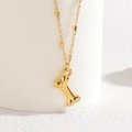Collana in acciaio inossidabile placcato oro 18k con ciondolo a osso su supporto - Osso