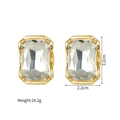 Macro shot of geometric gold earrings with large clear crystals and 3.2cm size specs - Large