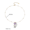 Detail view of golden necklace featuring a square purple zircon and a white pearl pendant - Gold