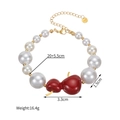 Dettaglio del bracciale di perle con ciondolo a zucca rossa, logo S.Steel e misure - Stile Zucca Rossa / Oro