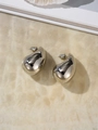 Detailed view of polished silver water drop earrings on a marble textured surface - Small / Silver