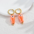 Gold-plated hoop earrings with orange fish pendant and white-beaded fish eye detail - Orange Small Fish