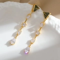 Long tassel earrings with green gemstones and clear cubic zirconia in a vintage gold finish - Gold