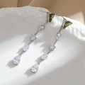 Elegant geometric long tassel earrings with green triangle and clear cubic zirconia stones - Silver