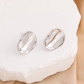 Irregular silver petal stud earrings on stone background for a minimalist luxury look - 18K Gold / Silver